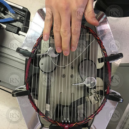 Badminton racquet being strung in our Calgary store.